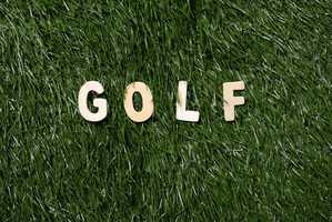 the word gold in a grass background - funny golf terms