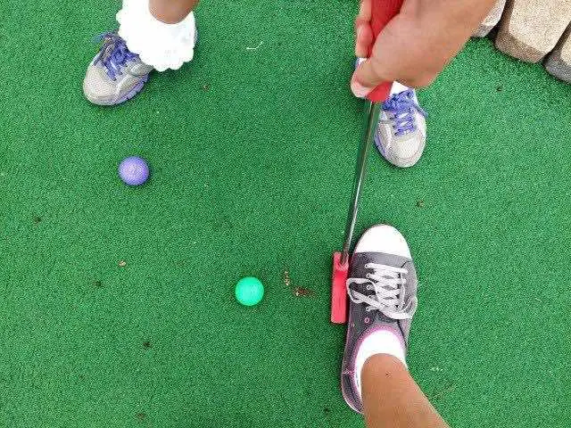 playing mini golf ball
