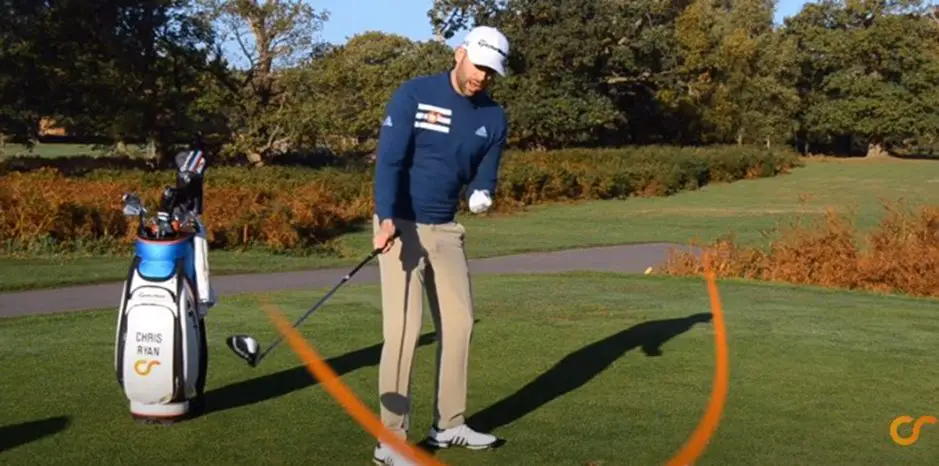 mid-aged man playing golf