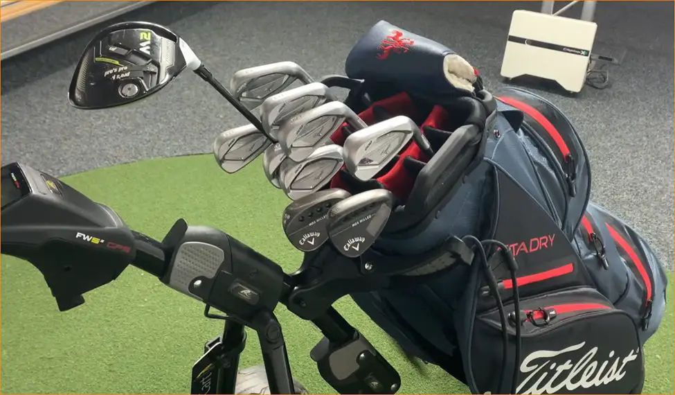 titleist golf bag with accessories in a push golf cart