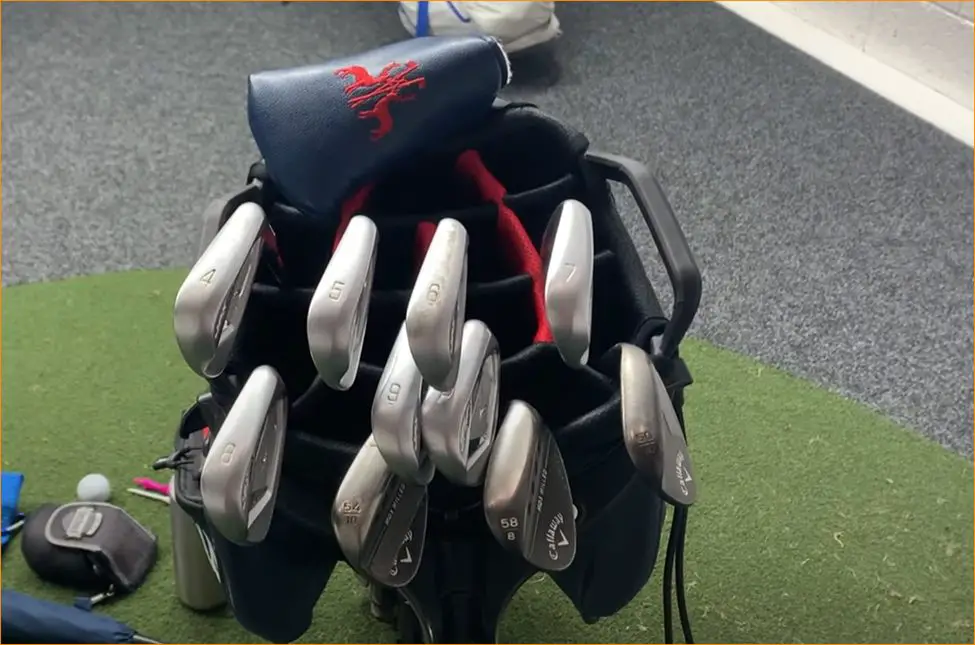 titleist golf bag with accessories on it