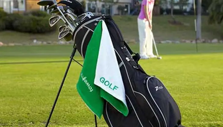 golf towel hanging on the golf bag