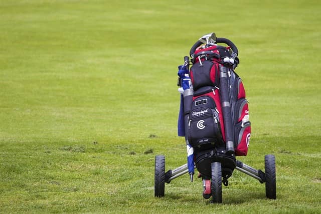 Premium golf travel bag with wheels on the course
