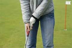 Golfer using a mild grip on a golf club